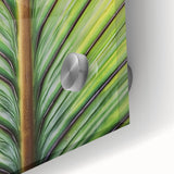 Large abstract floral art in vibrant orange and yellow hues on acrylic glass, ideal for dining room ambiance.