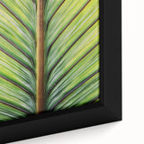 Close-up of black wall art featuring colorful, textured florals on a large framed canvas, ideal for living room decor.