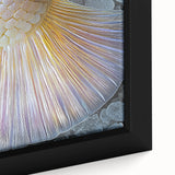 Close-up of textured black wall art featuring colorful abstract elements on a framed canvas, ideal for living room decor.