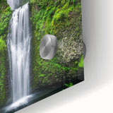 Large abstract wall art on acrylic glass in muted green and blue hues.