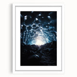 Framed landscape artwork showcasing a serene cave scene with intricate details, surrounded by a white mat, perfect for home decor or art collectors.