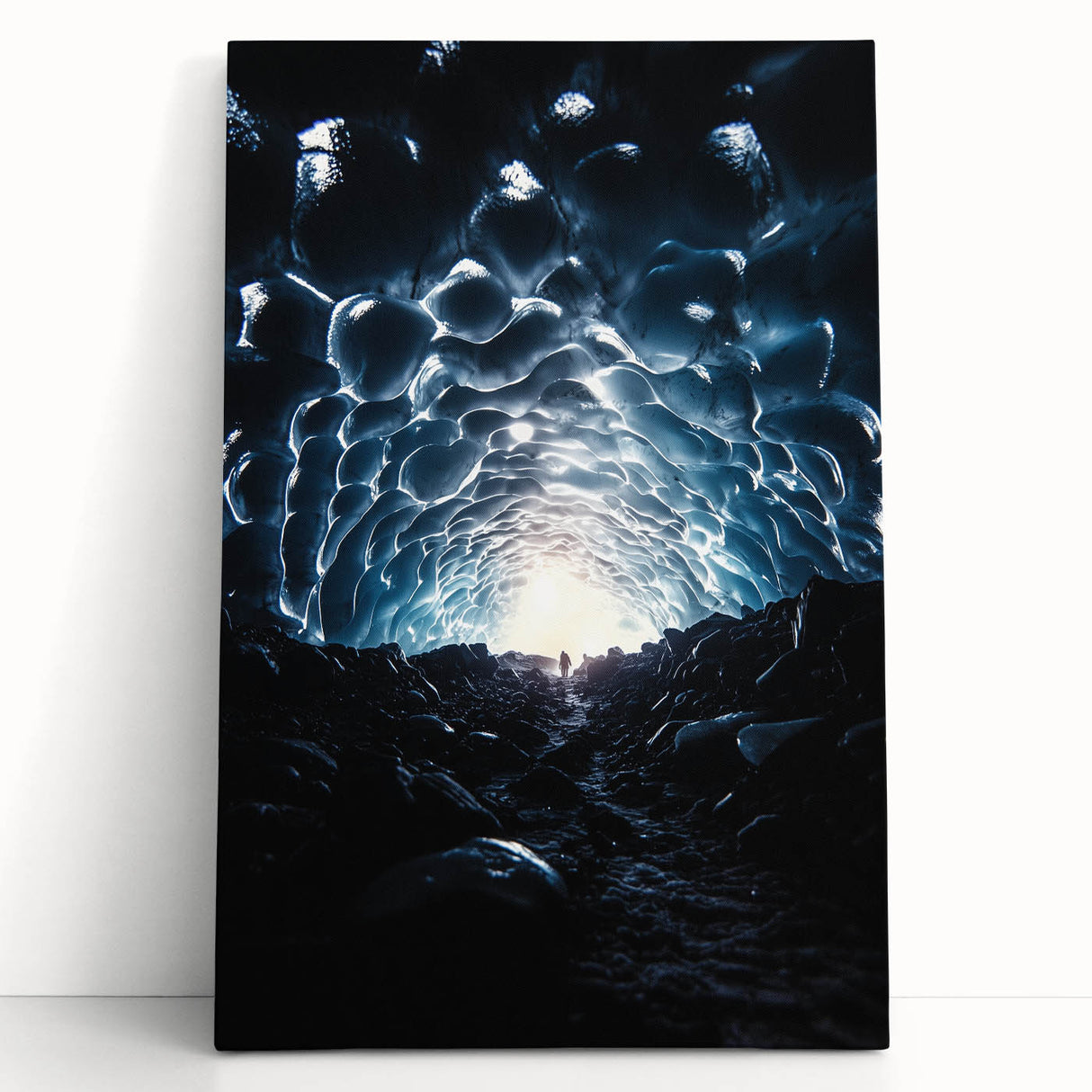 Stretched canvas artwork showcasing a vibrant landscape with intricate cave formations, leaning against a neutral wall, perfect for home decor enthusiasts.