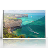 Framed acrylic artwork showcasing a vibrant landscape of rugged cliffs in rich earth tones, set against a clean white frame, perfect for modern decor.