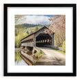 Extra large abstract art print of a colorful, textured covered bridge on a black framed canvas.