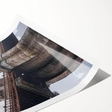 Rolled print showcasing a vibrant landscape bridge design with rich colors and intricate details, securely packaged in a protective cardboard tube for easy storage.