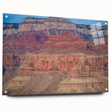 Acrylic glass artwork showcasing a vibrant landscape of canyons, viewed from the side with decorative pins, highlighting the intricate details and colors of the natural scenery.