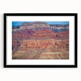 Black-framed landscape print showcasing dramatic canyons with vibrant colors, designed for elegant home decor, enhancing any living space aesthetic.