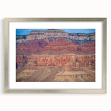 Framed landscape print showcasing a stunning canyon scene with a silver mat, perfect for home decor. The artwork's vibrant colors and intricate details enhance any room's ambiance.