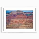 Front view of a landscape art print showcasing canyons framed with a white mat, ideal for home decor, emphasizing natural beauty and serene colors. Perfect for enhancing living spaces or as a thoughtful gift.