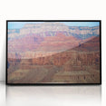 Framed acrylic print showcasing a stunning landscape of canyons with rich earthy tones, set in a sleek black frame, perfect for enhancing modern home decor.