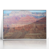 Framed acrylic artwork showcasing a stunning landscape of canyons, featuring vibrant colors and intricate details, perfect for enhancing home decor. The white frame adds elegance, making it an ideal centerpiece for any room.