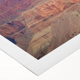 Stunning landscape canvas print showcasing vibrant canyons in rich earth tones, designed for wall decor enthusiasts, elegantly rolled for easy display and shipping.