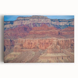 Vibrant landscape canvas artwork showcasing majestic canyons in rich earthy tones, ideal for home decor and enhancing interior spaces with natural beauty.