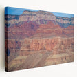 Stretched canvas artwork depicting a stunning landscape of canyons with vibrant colors, showcasing intricate details and textures, perfect for enhancing home decor.