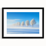 Black-framed landscape artwork featuring a picturesque countryside scene with lush green fields and a bright blue sky, elegantly matted to enhance its beauty.