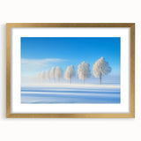 Elegant gold-framed landscape artwork featuring a serene countryside scene with vibrant greens and blues, complemented by a white mat, ideal for home decor.
