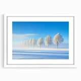Framed landscape artwork showcasing a serene countryside scene, featuring vibrant greens and soft blues, presented in a white mat for an elegant finish.