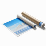 Rolled print showcasing a vibrant countryside landscape, featuring lush green fields and a clear blue sky, elegantly packaged in a protective cardboard tube. Ideal for home decor enthusiasts seeking a serene nature-inspired art piece.