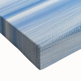 Close-up of a stretched canvas featuring a vibrant countryside landscape with rolling hills, lush greenery, and a bright blue sky, ideal for home decor.