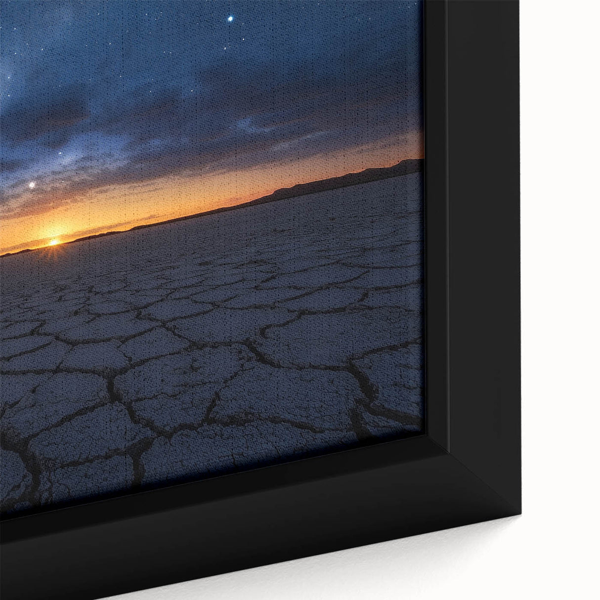Close-up of a beautifully framed desert landscape canvas, showcasing vibrant hues of orange and yellow with intricate details of the sand dunes and sky, perfect for home decor.