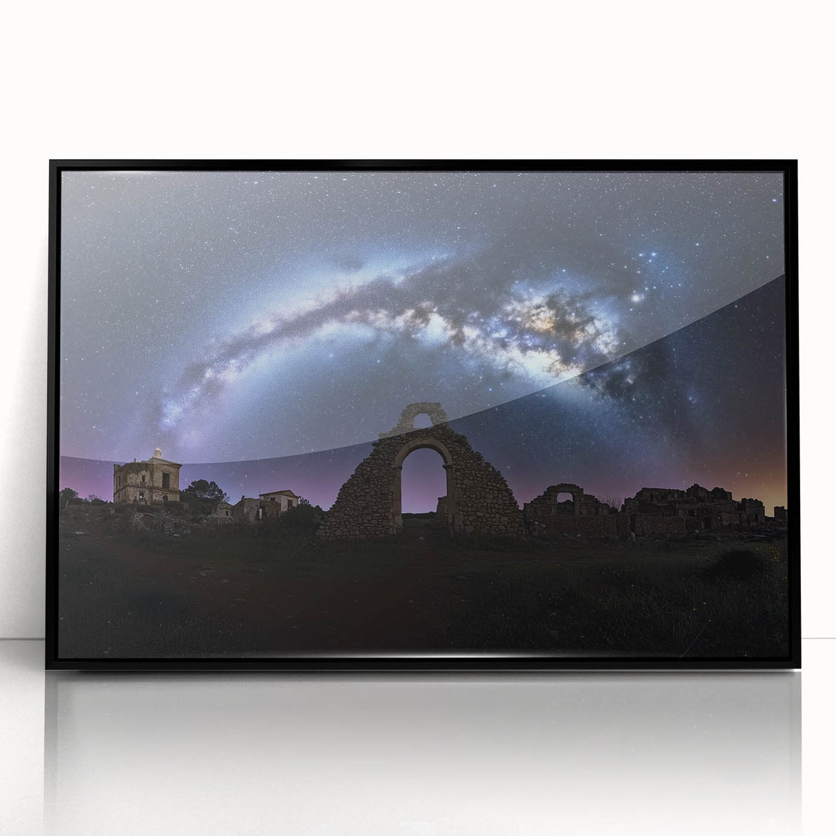Framed acrylic landscape artwork showcasing a picturesque castle scene against a vibrant sky, presented in a sleek black frame, ideal for home decor.