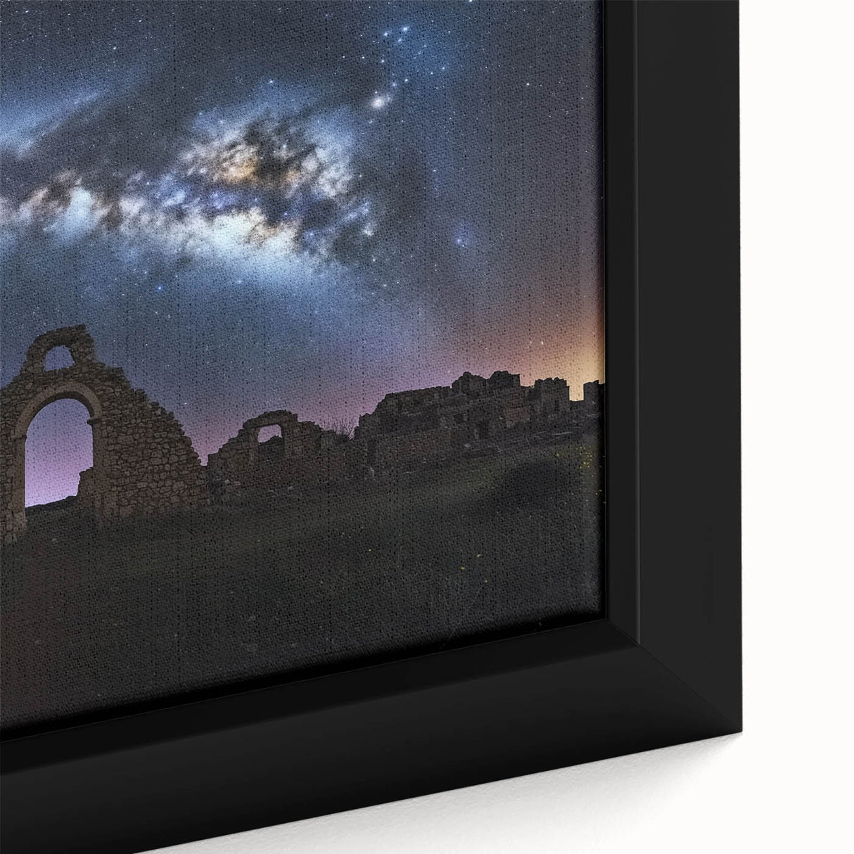 Close-up of a framed canvas artwork showcasing a vibrant landscape featuring a medieval castle surrounded by lush greenery, ideal for home decor.