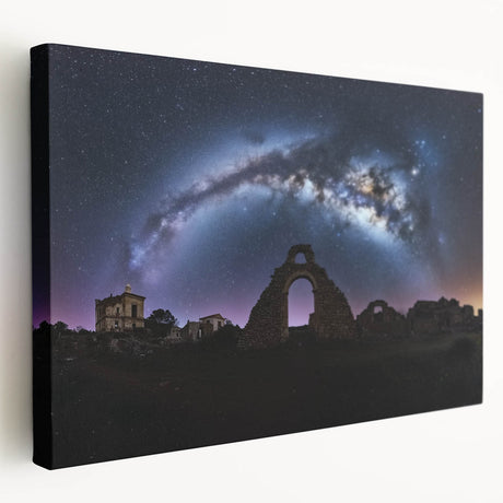 Stretched canvas artwork depicting a serene landscape with a majestic castle, surrounded by lush greenery under a bright blue sky, perfect for enhancing home decor.