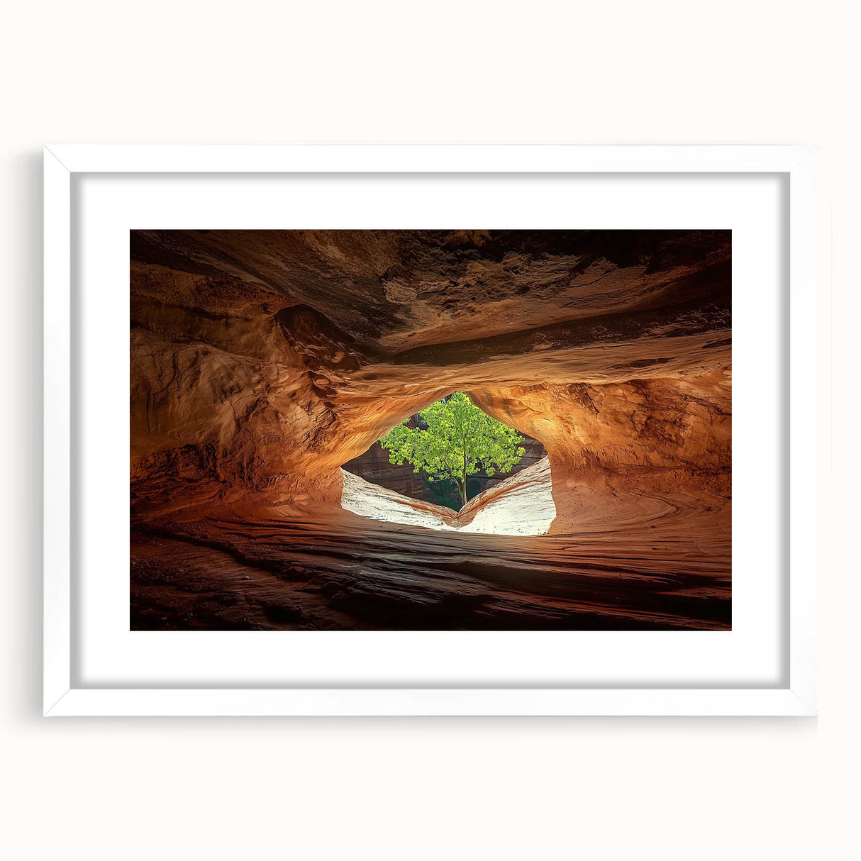 Framed landscape artwork depicting a serene cave scene, featuring a white matting and a sleek black frame for an elegant display, ideal for home decor.