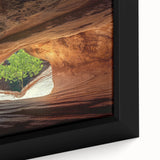 Close-up of a framed canvas print showcasing a vibrant landscape with intricate cave formations and earthy tones, perfect for home decor and nature enthusiasts.