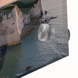 Close-up of a vibrant acrylic painting depicting dramatic cliffs and landscapes in rich hues of blue and green, perfect for modern home decor.