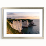 Framed landscape artwork depicting stunning cliffs in soft silver tones, featuring a mat border for an elegant finish, ideal for home decor enhancement.