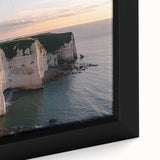 Close-up of a framed canvas depicting a dramatic landscape of rugged cliffs and vibrant greenery, showcasing intricate details and rich colors, perfect for home decor.