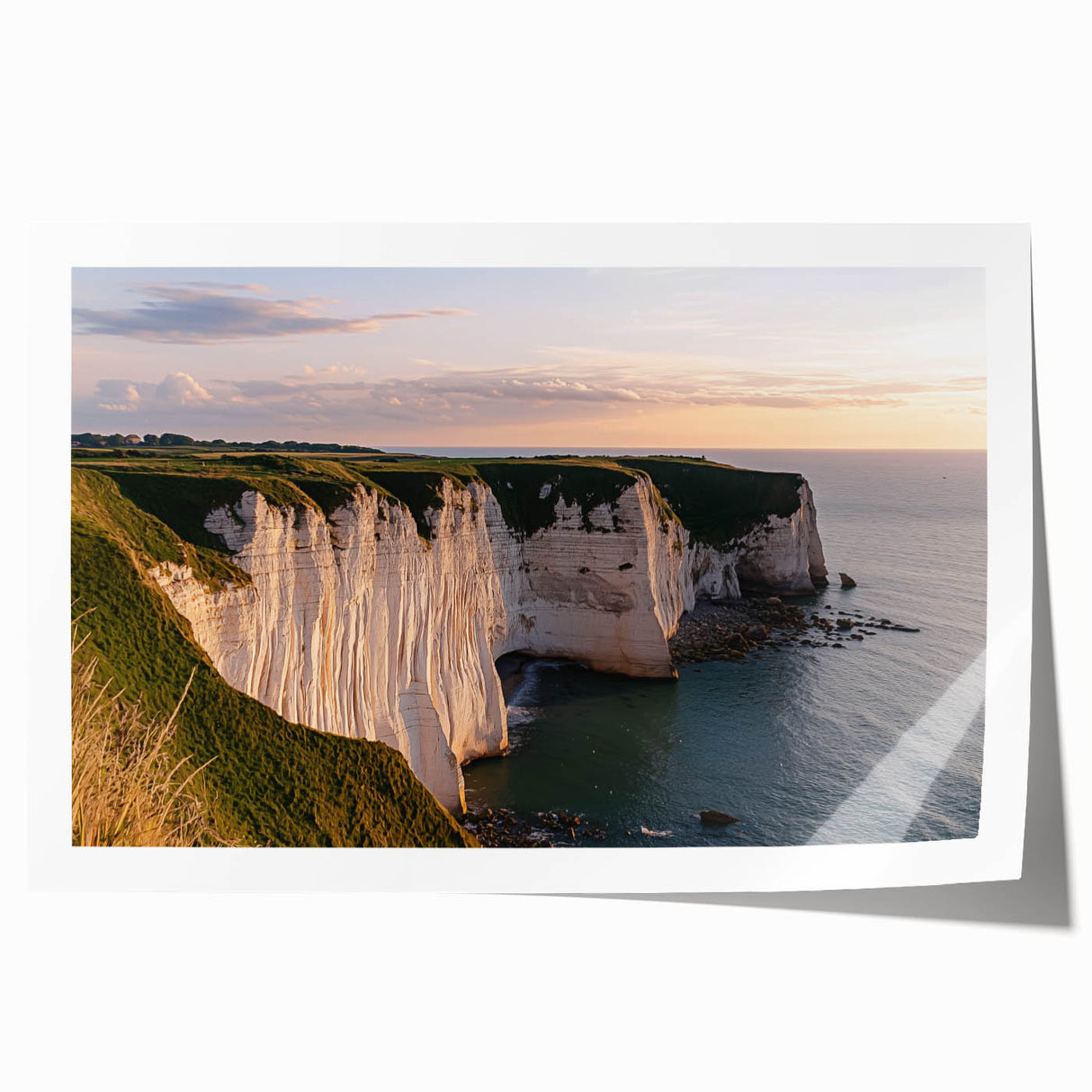 Vibrant landscape print showcasing dramatic cliffs and a serene sky, rolled and ready for display. Perfect for nature lovers seeking wall decor.