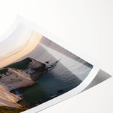 Vibrant rolled print showcasing a stunning coastal landscape with dramatic cliffs and a serene ocean view, ideal for home decor or art collectors.