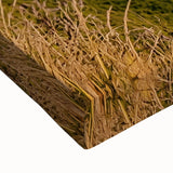 Close-up of a stretched canvas artwork showcasing a dramatic landscape with towering cliffs and vivid colors, perfect for home decor and art enthusiasts.