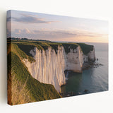 Stretched canvas artwork showcasing a breathtaking landscape of majestic cliffs under a vibrant sunset, perfect for enhancing home decor with natural beauty.