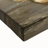 Close-up of a large art piece featuring a monochrome fruit landscape, printed on stretched canvas.