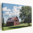 Stretched canvas artwork depicting a serene landscape with a rustic barn, showcasing rich greens and earthy tones, ideal for farmhouse decor enthusiasts.