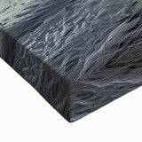 Close-up of a stretched canvas artwork depicting a scenic landscape with a bridge, showcasing vibrant colors and intricate details, ideal for home decor.