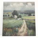 Stretched canvas wall art depicting a serene countryside landscape with rolling hills, green fields, and a vibrant blue sky, perfect for home décor.