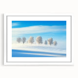 Countryside landscape framed art with a white mat, showcasing vibrant green fields under a clear blue sky, perfect for home decor in rustic settings.