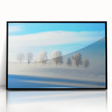 Framed acrylic print of a serene countryside landscape, showcasing rolling hills and lush greenery, with a sleek black frame that enhances its beauty.