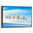 Framed canvas artwork depicting a serene countryside landscape, showcasing lush green fields and a vibrant blue sky, presented in a sleek black frame for modern decor.