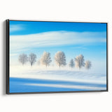 Framed canvas artwork depicting a serene countryside landscape, showcasing lush green fields and a vibrant blue sky, presented in a sleek black frame for modern decor.