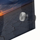 Close-up view of a vibrant acrylic landscape artwork depicting a desert scene, showcasing warm hues of orange and yellow against a textured glass surface, ideal for modern home decor.