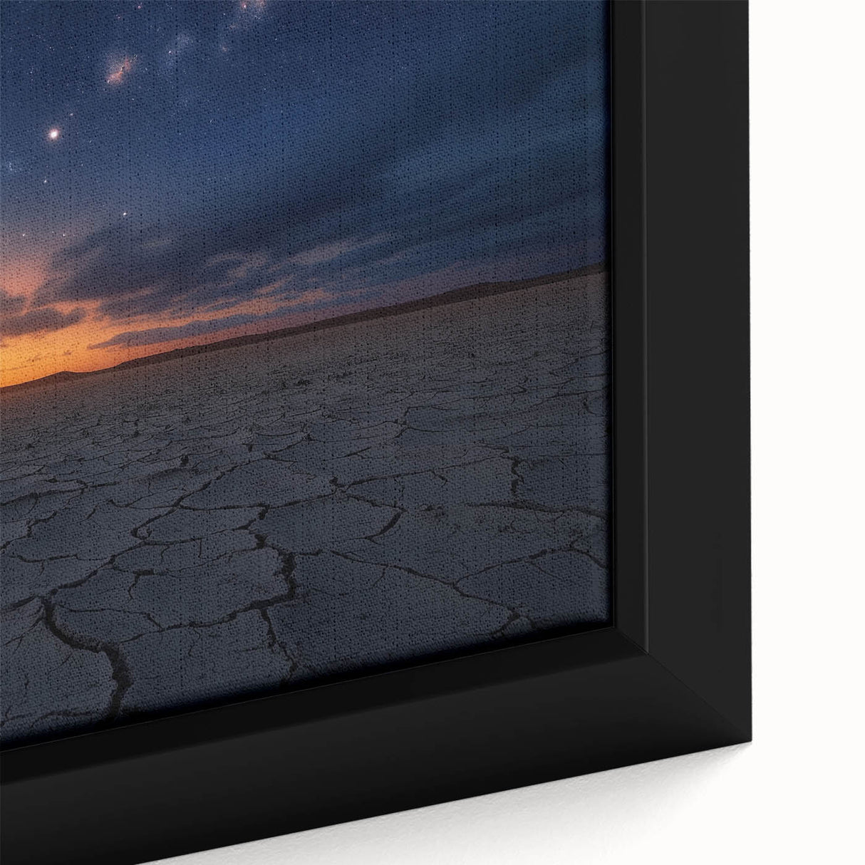 Close-up of a framed canvas artwork depicting a serene desert landscape, showcasing warm tones of orange and yellow with intricate textures, ideal for modern home decor.