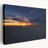 Stretched canvas artwork depicting a vibrant desert landscape, showcasing warm hues of orange and yellow with detailed cacti and mountains, perfect for home decor.