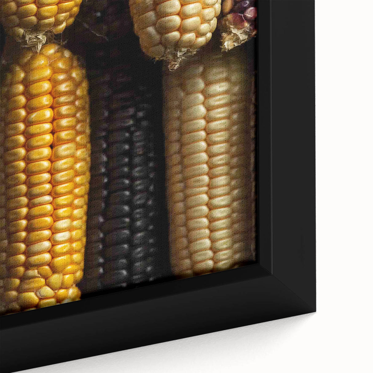 Close-up of a black framed canvas featuring a colorful, textured depiction of nature elements, ideal for living room decor.