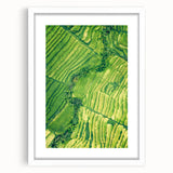 Abstract art print featuring swirling pastel colors on a white-framed canvas, suitable for bedroom or dining room decor.