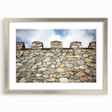 Elegant silver-framed landscape artwork featuring a majestic castle, complete with a mat background, perfect for enhancing home decor with a touch of sophistication.